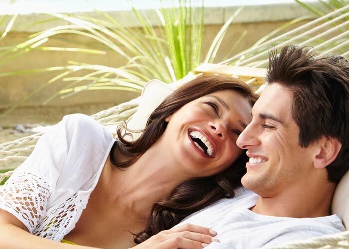 Young couple celebrating their new pool and patio project completion in Fort Pierce