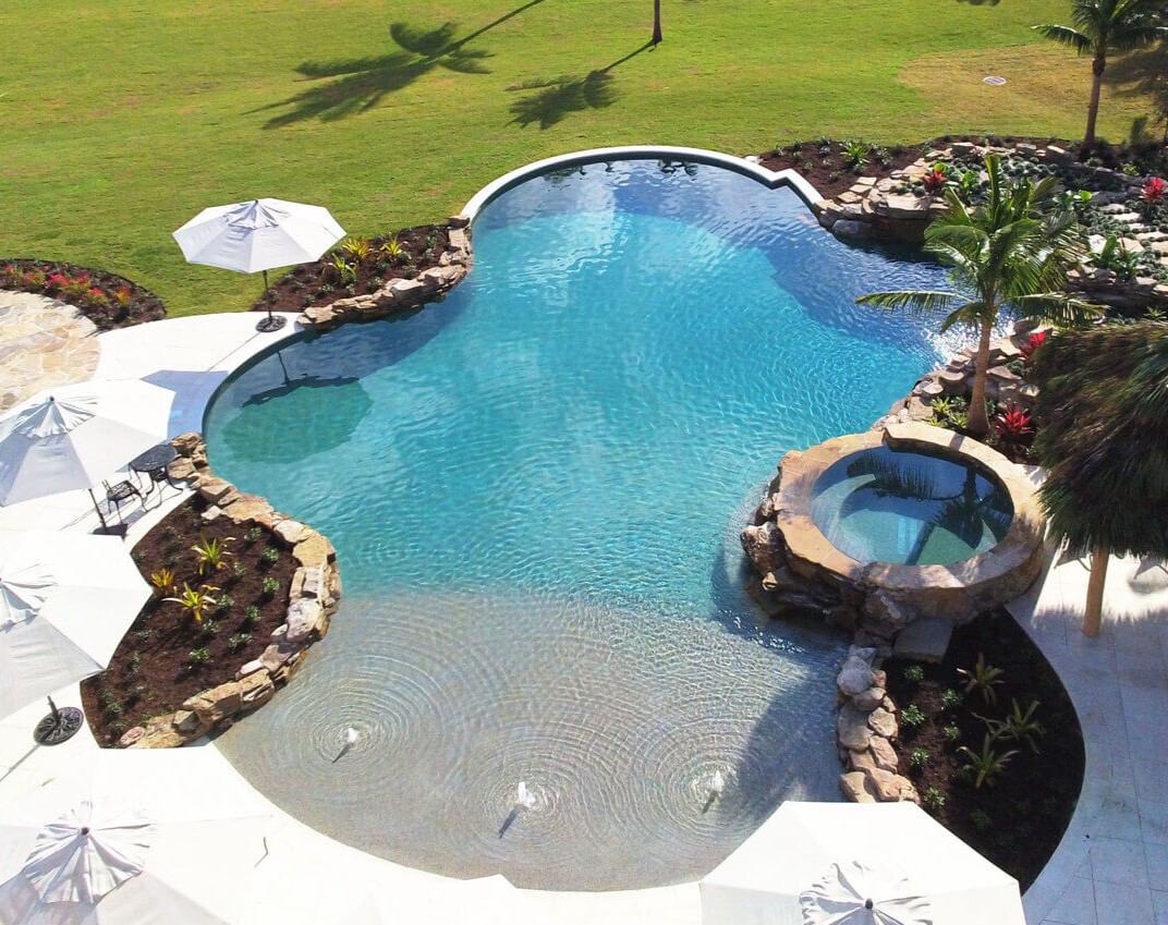 Slide Custom luxury inground swimming pool with spa - Professional pool installation and design