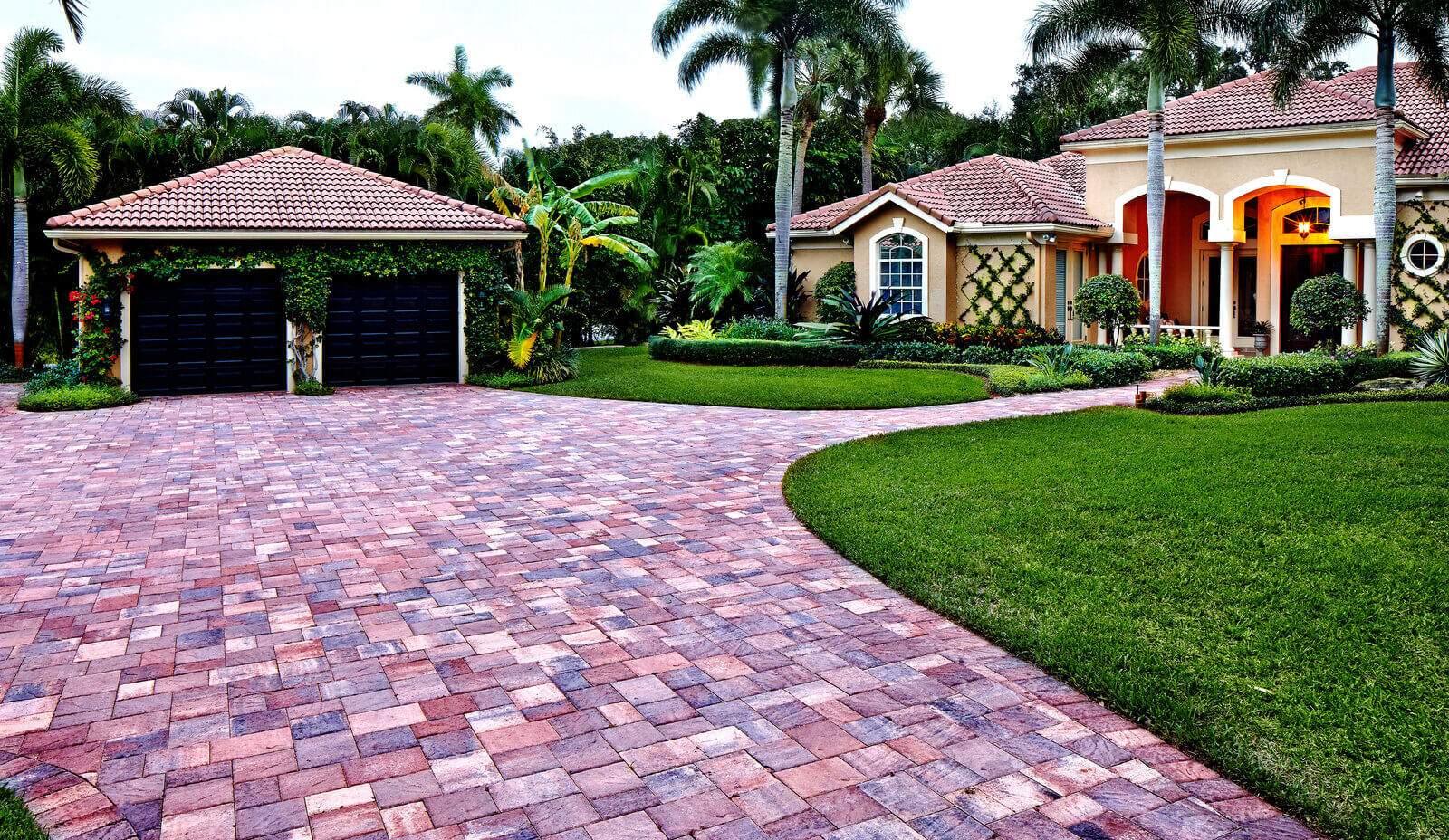 Slide Elegant brick paver driveway installation - Durable and beautiful hardscape design