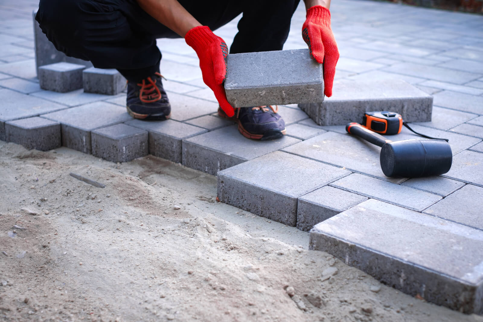 Professional brick paver installation process with expert craftsmanship