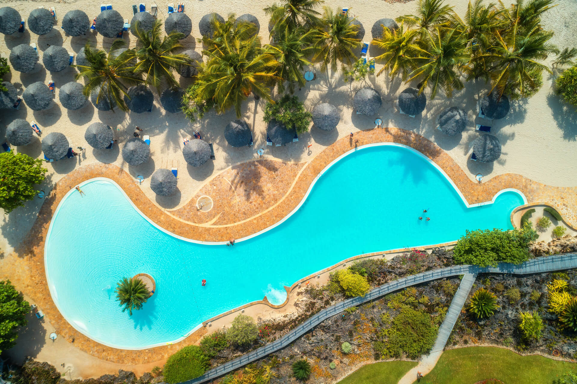 Luxury resort pool with infinity edge design and premium hospitality features in Jupiter