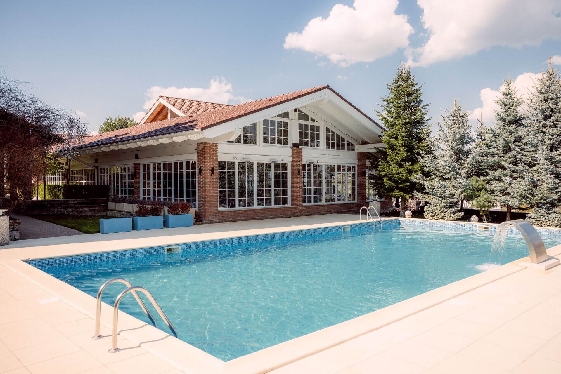 Large community pool with safety features and ADA compliant accessibility in Jupiter