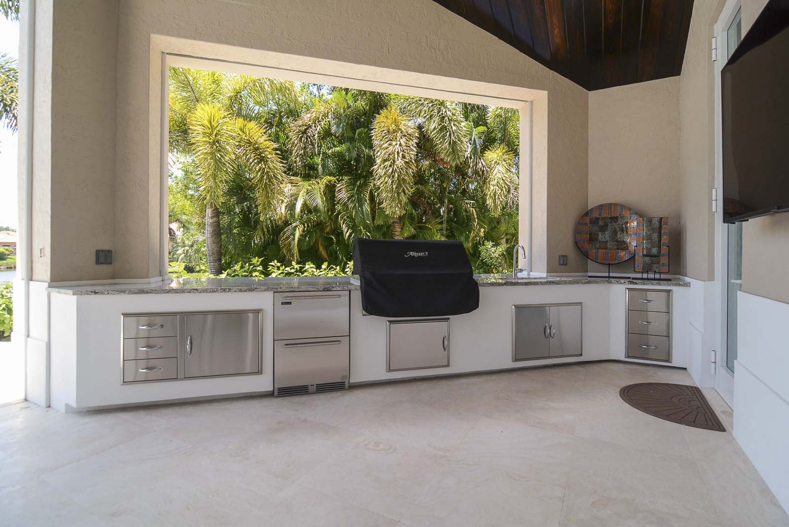 Elegant outdoor living area with custom features and professional design