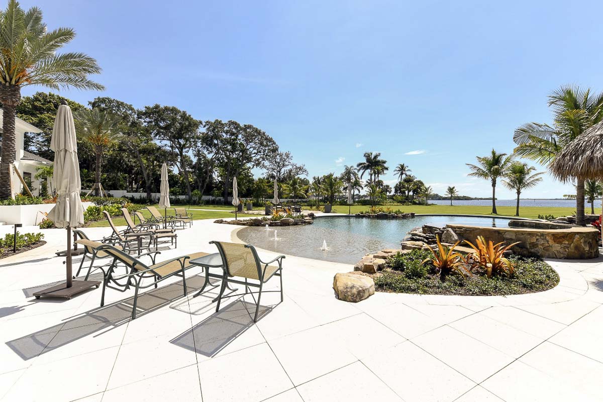 Beautiful pool deck with custom paver installation and modern design