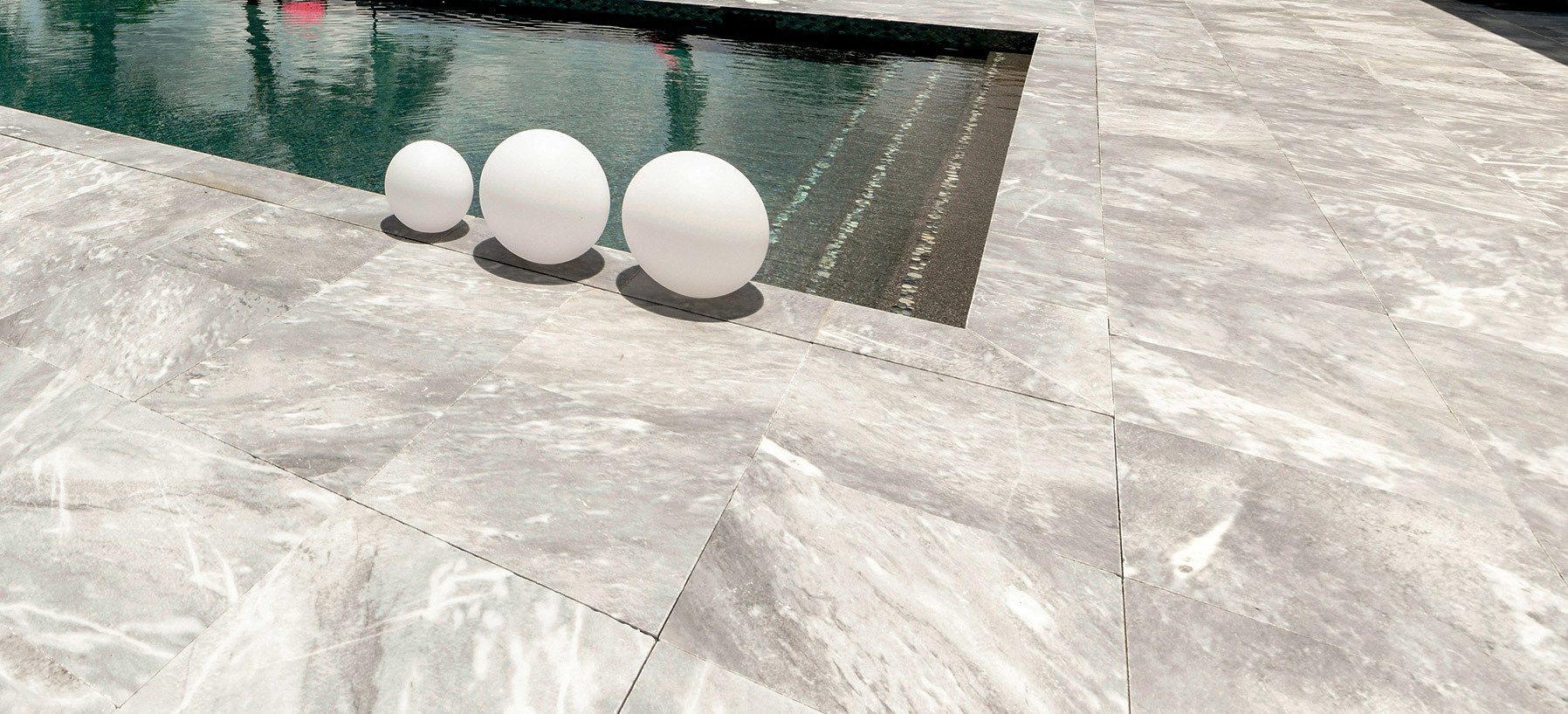 Custom pool deck installation with premium pavers and professional craftsmanship<?php echo e($cityString); ?>