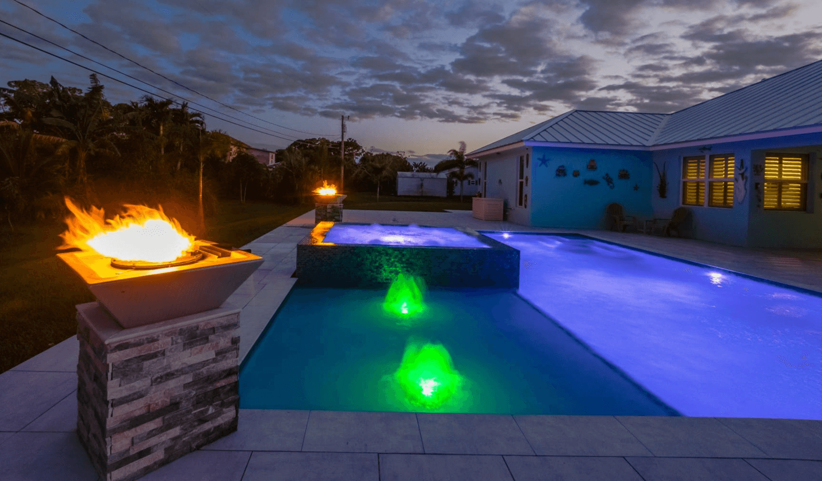 Custom water features and lighting installation for enhanced ambiance
