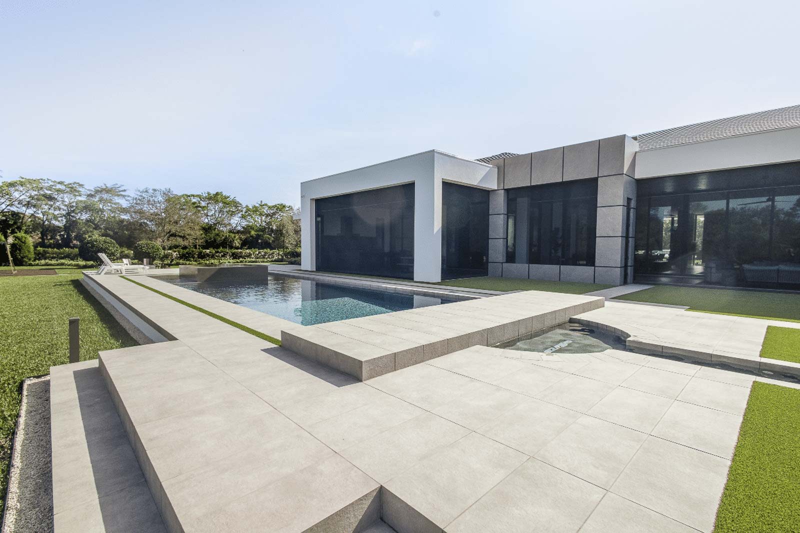 Pool deck installation process showing professional paver laying techniques in Juno Beach, Florida
