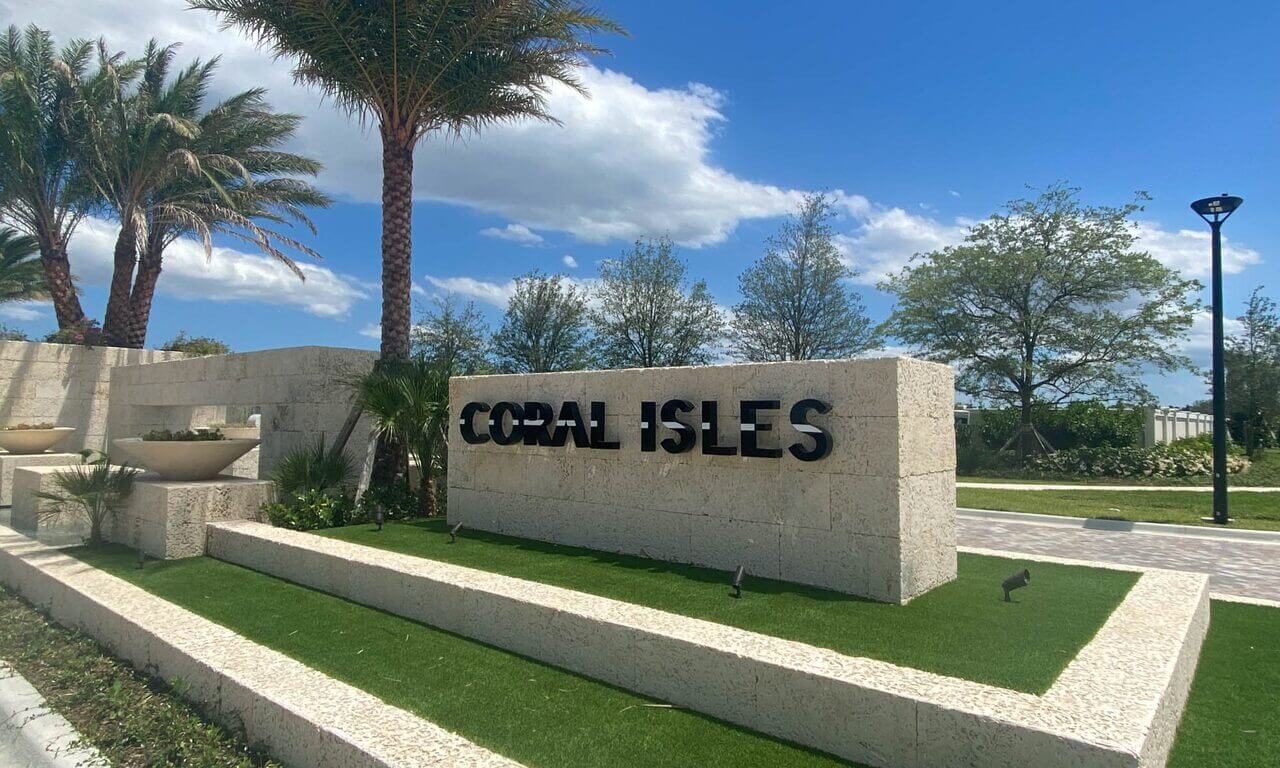 Elegant estate home luxury pool design for Coral Isles at Avenir with lush landscapes and water features