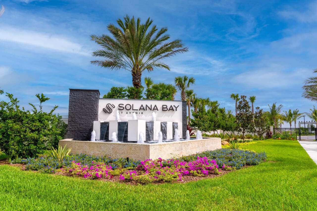 Lakefront living pool design for Solana Bay at Avenir with infinity edges and elevated spas