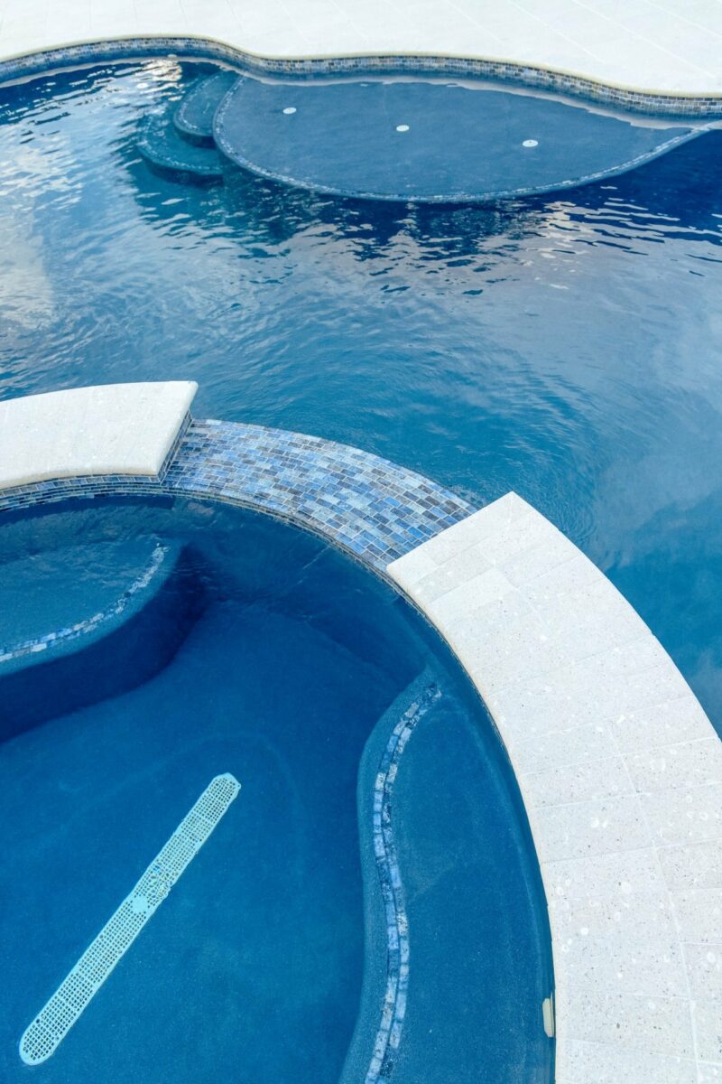 apex pavers pools contractor builder stuart palm beach senior couple relaxing in pool